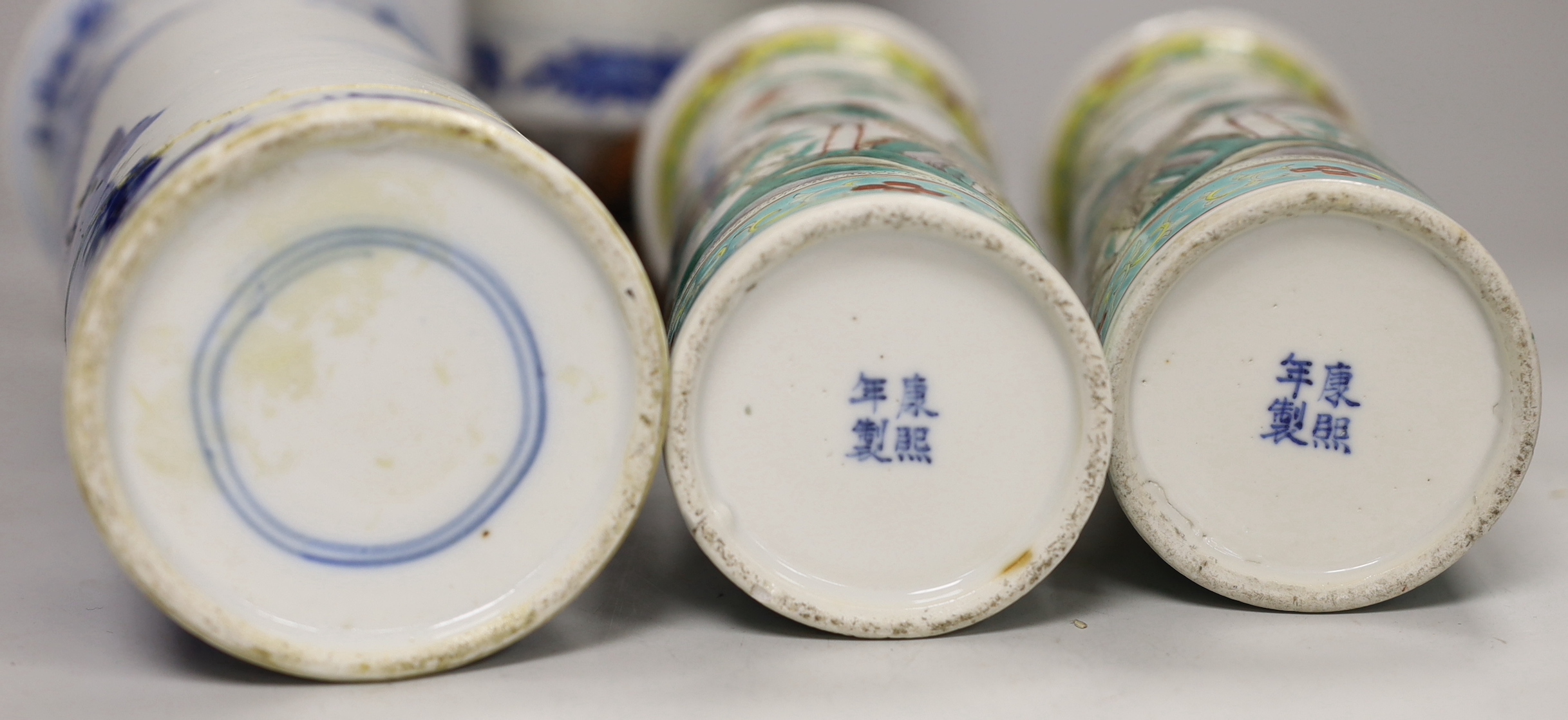 Two 19th century Chinese blue and white cylinder vases, one on stand and a pair of famille verte cylinder vases, tallest 30cm high